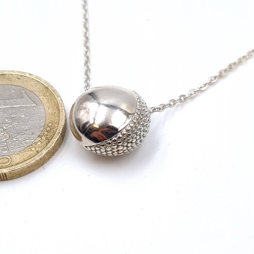 708 - A sterling silver orb and chain, length of chain 42cm, weight 7 grams.