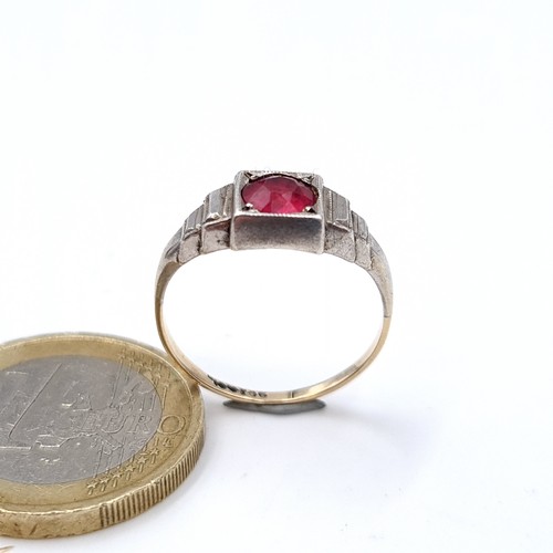 711 - Star Lot : A 9K white gold diamond and ruby stone ring, size M, weight 2.57 grams, boxed.