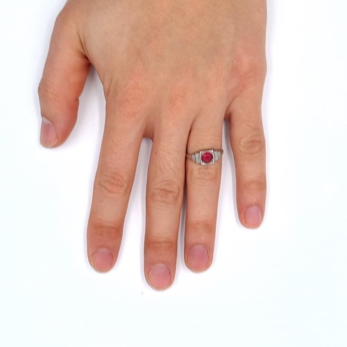 711 - Star Lot : A 9K white gold diamond and ruby stone ring, size M, weight 2.57 grams, boxed.