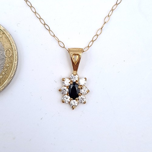 720 - A sapphire flower pendant, hallmarked 9K gold to mount and chain, set with gemstone surround, length... 