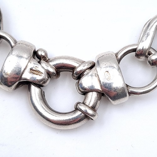 723 - A sterling silver chain linked bracelet, weight 19.9 grams.