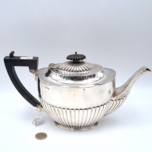 726 - Star Lot . Three piece sterling silver tea set consisting of tea pot with ebonized handle hallmarked... 