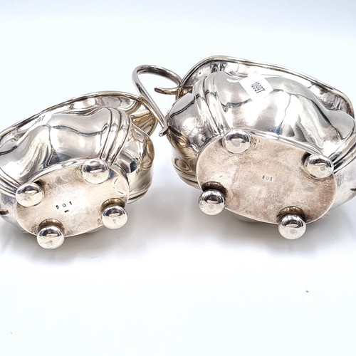 727 - Star Lot : A sterling silver sugar together with a matching cream jug hallmarked Birmingham, maker J... 