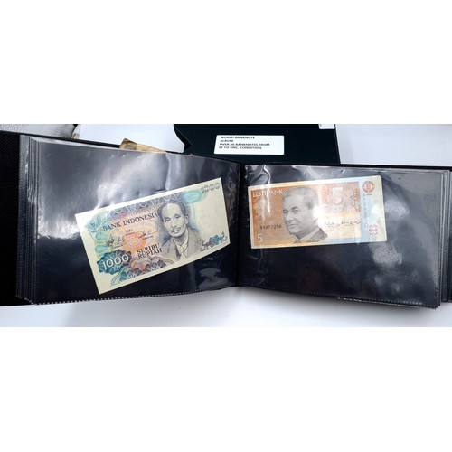 728 - A world banknote album of over 80 banknotes set in a leatherbound volume, notes from extra fine to u... 