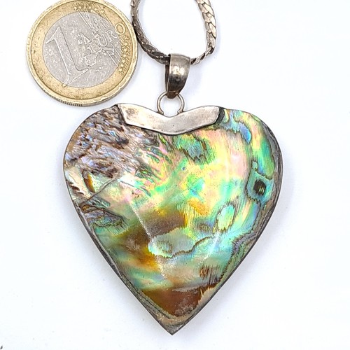 754 - A very pretty sterling silver heart shaped pendant with abalone shell detail together with chain, le... 