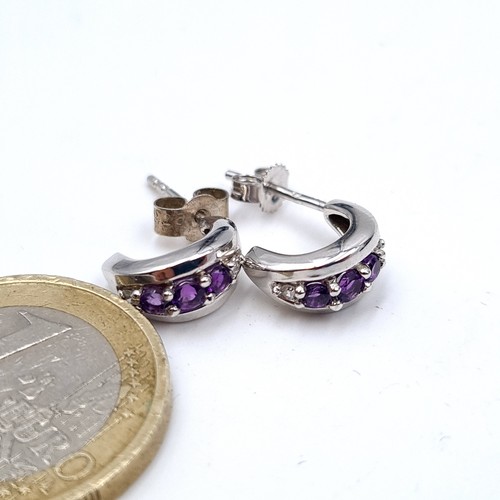 770 - Star Lot : A very fine pair of 9K white gold amethyst and diamond stud earrings, old new stock, neve... 