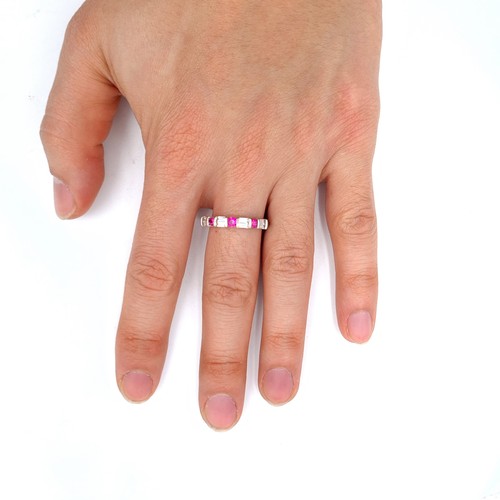 778 - Star Lot : A fine example of a ruby and diamond half eternity ring, set in 10K white gold, size P, w... 