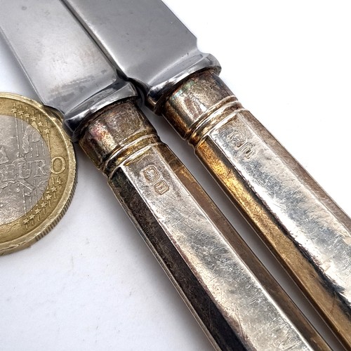 784 - Five sterling silver handle button knives, hallmarked Sheffield.