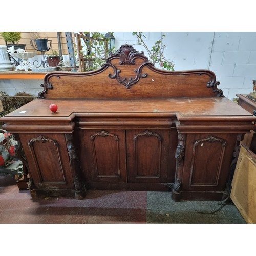 612 - Star Lot: A magnificent antique Victorian sideboard boasting fabulous carved scroll and leaf detail ... 