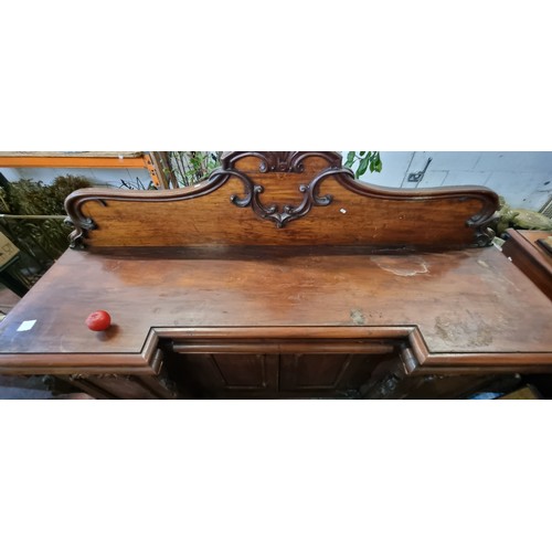 612 - Star Lot: A magnificent antique Victorian sideboard boasting fabulous carved scroll and leaf detail ... 