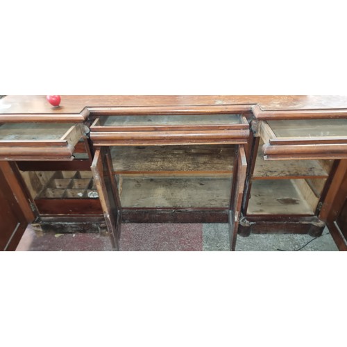 612 - Star Lot: A magnificent antique Victorian sideboard boasting fabulous carved scroll and leaf detail ... 