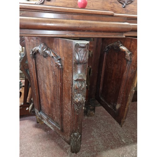 612 - Star Lot: A magnificent antique Victorian sideboard boasting fabulous carved scroll and leaf detail ... 