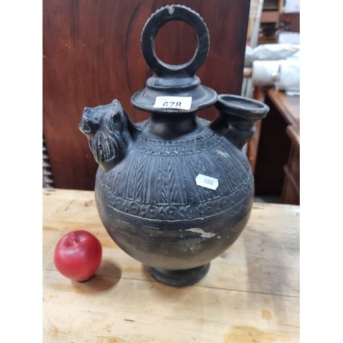 1006 - Star Lot : A very interesting antique wine pitcher with beautiful detailing throughout and an unusua... 