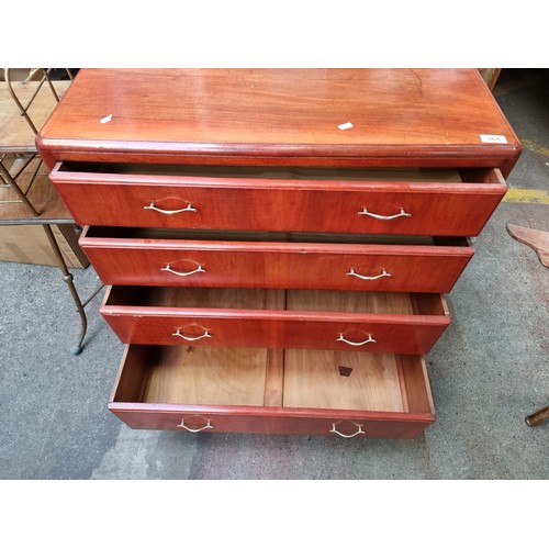 364 - Star lot : A handsome mid-century dresser with four drawers featuring delicate brass handles.