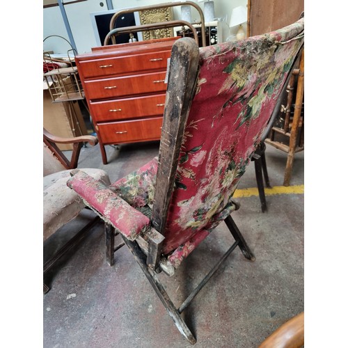 429 - A charming Victorian armchair with floral upholstery. A restorer's dream.  From the stables of the a... 