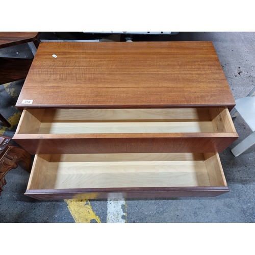 374 - Star Lot : A superb vintage mid century console table with two drawers to base held on stylish taper... 