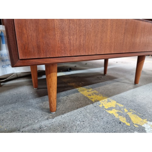 374 - Star Lot : A superb vintage mid century console table with two drawers to base held on stylish taper... 