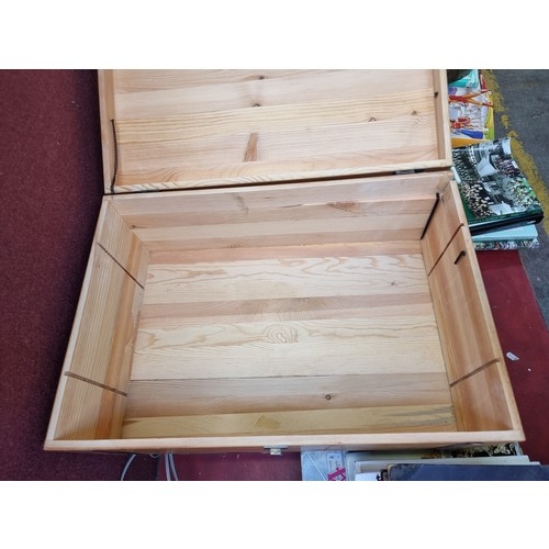 399 - A good quality wooden case with heraldic crest to front, opening to reveal large central storage spa... 