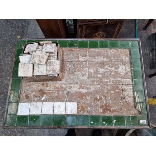 460 - A Victorian tile topped table with brass bound edge. Comes with original tiles to restore top. Prove... 