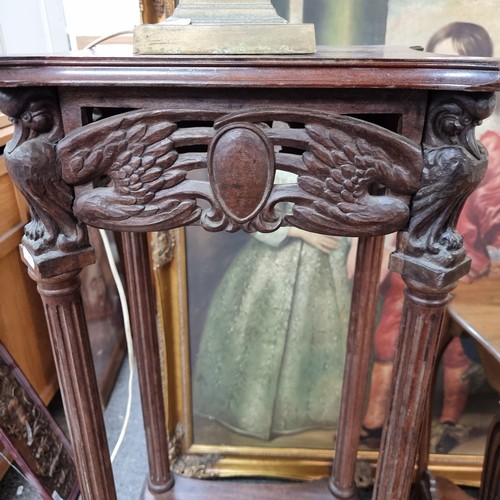 919 - A very ornate early 20th century plant stand with profusely carved detailing, shelf to base and ball... 