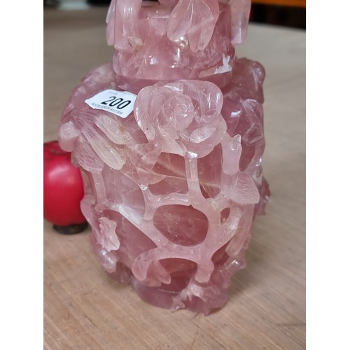 200 - A very heavy  gorgeous rose quartz urn vase featuring intricate hand carved floral and bird design i... 