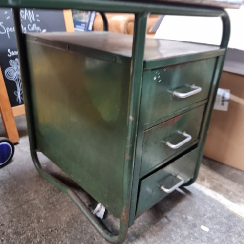 872 - A super retro green workbench supported by metal legs, with a petite filing cabinet fitted nicely un... 