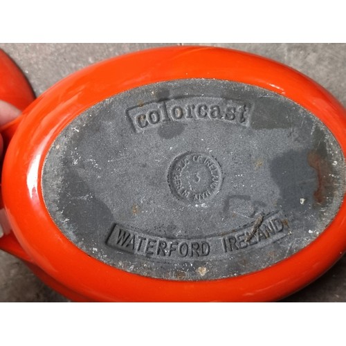 202 - A vintage very heavy cast iron Colorcast Waterford Ireland dutch oven with lid and handles in an ora... 