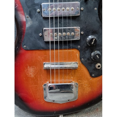 268 - Star lot: A rare vintage Harmony electric guitar with all strings, a black and brown finish and blac... 