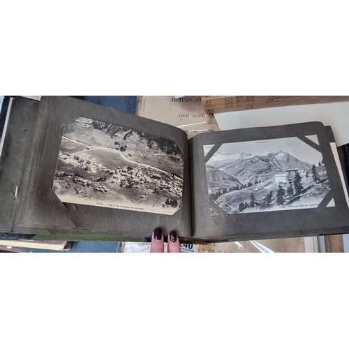 296 - A vintage full post card album containing antique and vintage black and white postcards from Scotlan... 