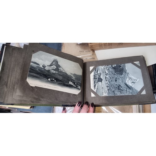 296 - A vintage full post card album containing antique and vintage black and white postcards from Scotlan... 