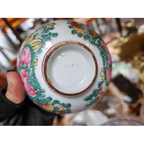 354 - Two antique Chinese Famille rose cups along with a matching saucer. In very good condition.