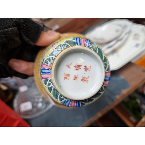 355 - A wonderful early 20th century Chinese teacup and saucer set in an attractive yellow glaze with intr... 