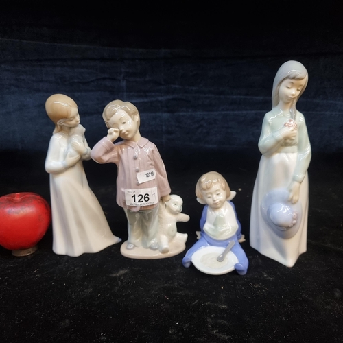 126 - A group of four Nao figures depicting children in different poses. In very good condition.