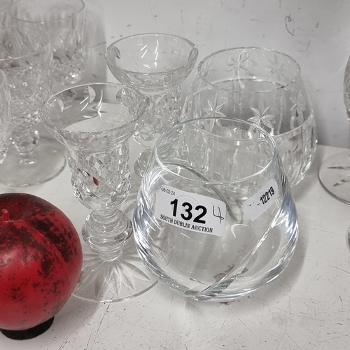 132 - Four Waterford crystal items including two candle holders and two large Waterford Crystal brandy gla... 