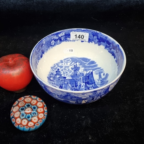 140 - Two items including an antique blue and white bowl along with a vintage paperweight.