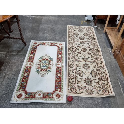 443 - Two rugs including a pretty and high quality Chinese wool cream wool rug with rose border pattern ex... 