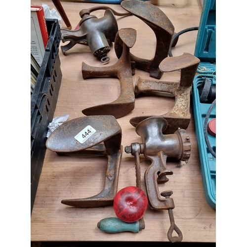 444 - Six antique cast iron items including a Kenrick mincer and an Enterprise food chopper. This lot also... 