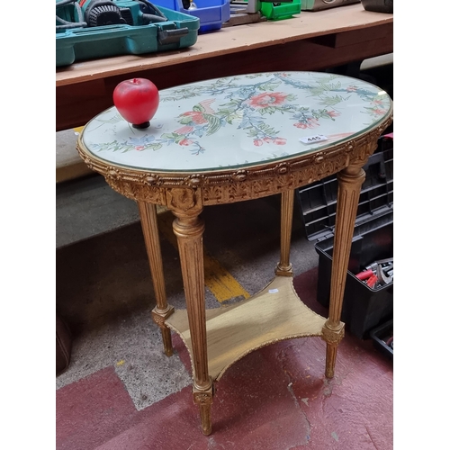 445 - A stunning molded gilt wood oval side table with beautiful floral fabric top under glass. Featuring ... 