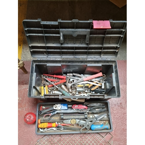 450 - A large toolbox with removable shelf to interior, filled with a large amount of tools including hamm... 