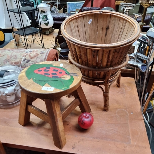 459 - A vintage wooden stool with charming hand painted ladybird seat. along with a bamboo planter and foo... 