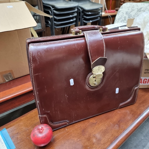 489 - A circa 1960's leather doctors briefcase by Penguin.