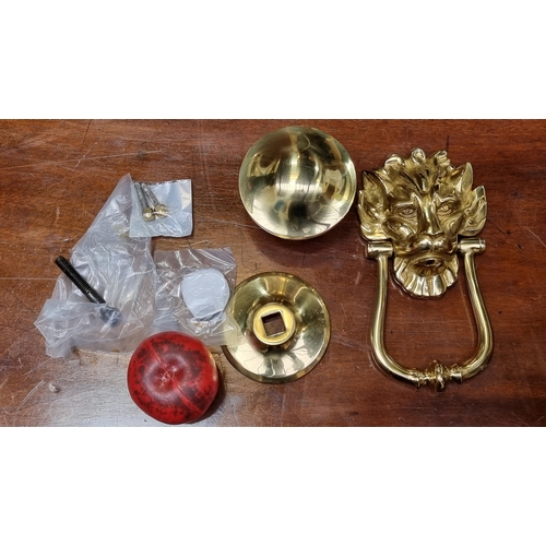 490 - A heavy large brass lion mask head knocker along with heavy brass door knob.