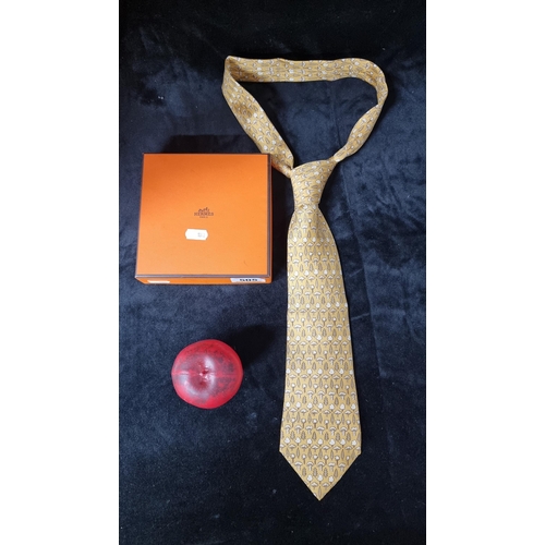 505 - A classy Hermes silk tie featuring wonderful repeating tree pattern on primrose yellow. Includes ori... 