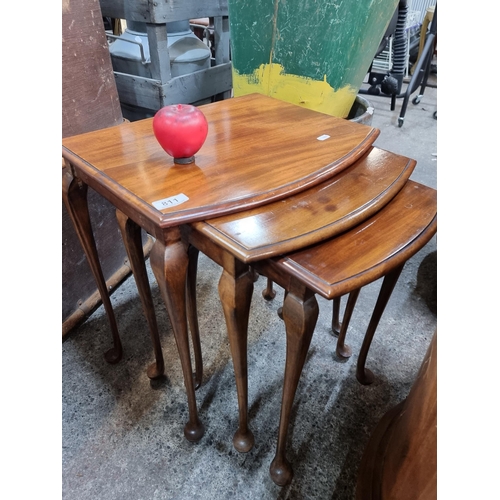 811 - A charming set of 3 nesting tables featuring cabriole legs. With a lovely warm grain. From a fabulou... 