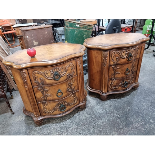 812 - A pair of wonderful ornate three drawer bedside lockers / chests featuring metal hardware and three ... 