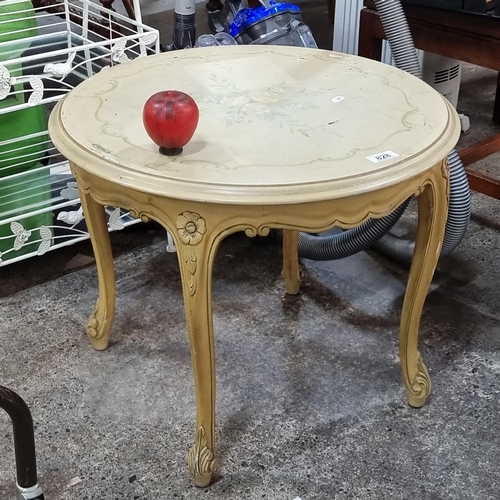 828 - A charming French side table featuring floral design to top and cabriole legs.