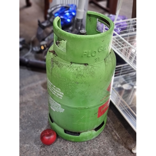 830 - A probably full 11kg Flogas propane gas canister. very heavy,