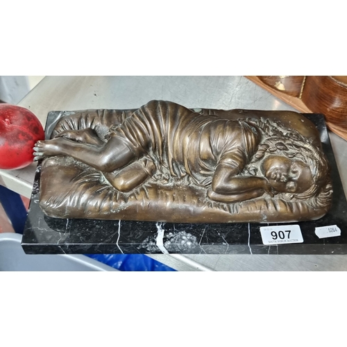 907 - Star Lot : A super heavy unsigned bronze sculpture of a sleeping girl mounted on a black marble plin... 