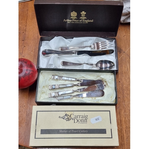 917 - Two vintage silverware sets including four Carraig Donn cheese knives with mother of pearl handles a... 