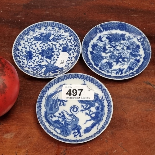 497 - A trio of antique Chinese blue and white pin dishes.